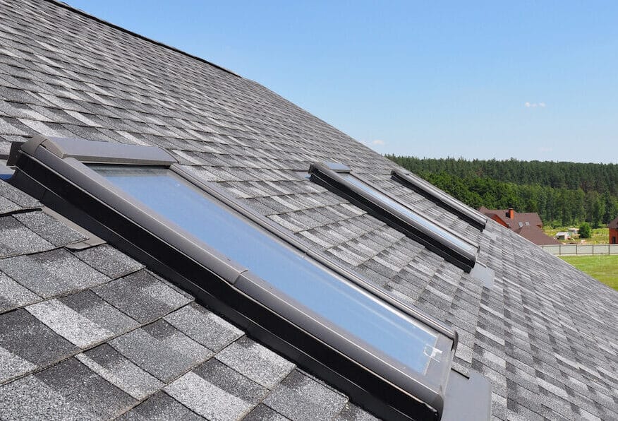 Roof windows and skylights and blue sky